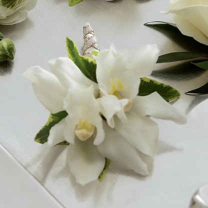 White Mini Cymbidium Boutonniere – ANITA'S FLOWERS AND ICE CREAM LLC, Passaic NJ